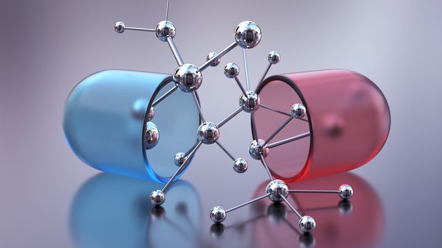 A blue and white capsule in half with drug molecules in between. 