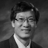 A photograph of Gen Li, PhD, MBA