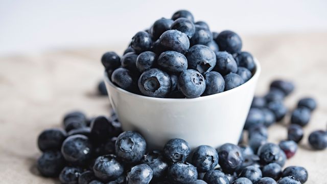 An overflowing bowl of blueberries. 