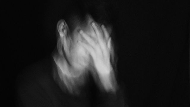 A person experiencing dizziness.  
